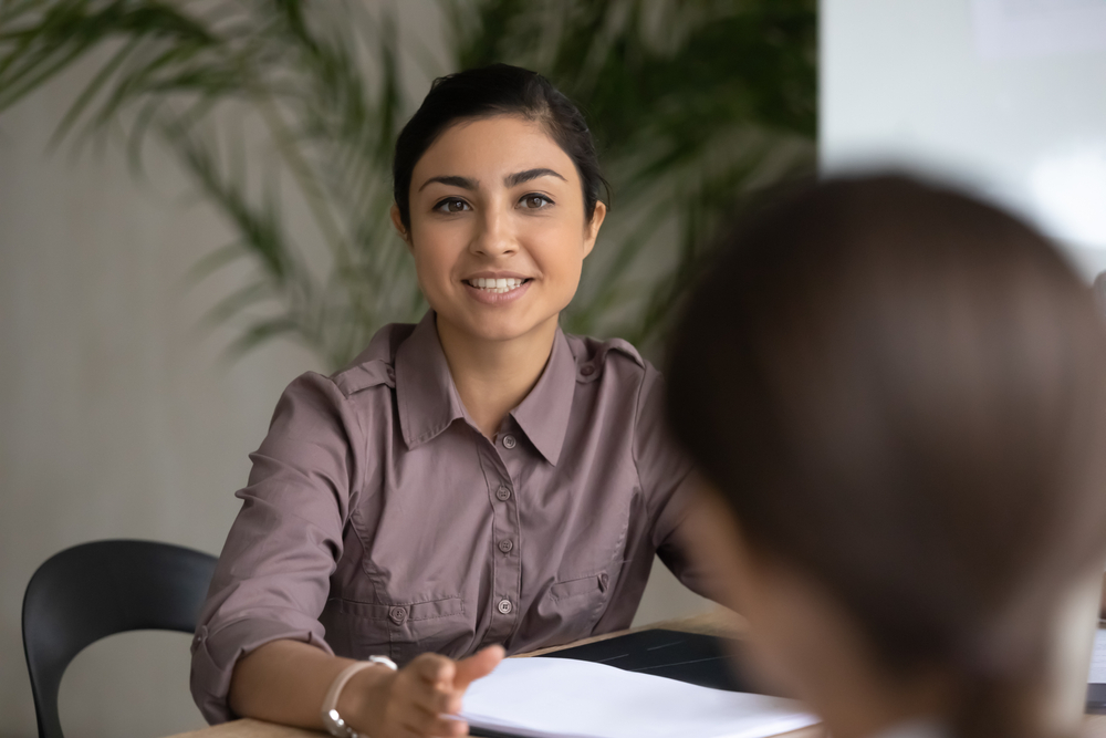 Two employees having a leadership meeting.