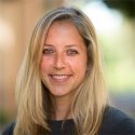 woman with long blond hair in a dark shirt